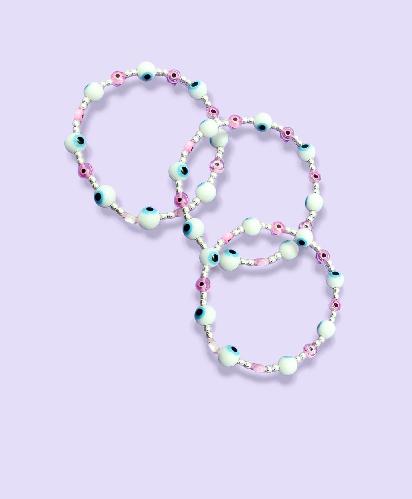 Pulsera de bolitas de plata con ojito turco rosa y blanca