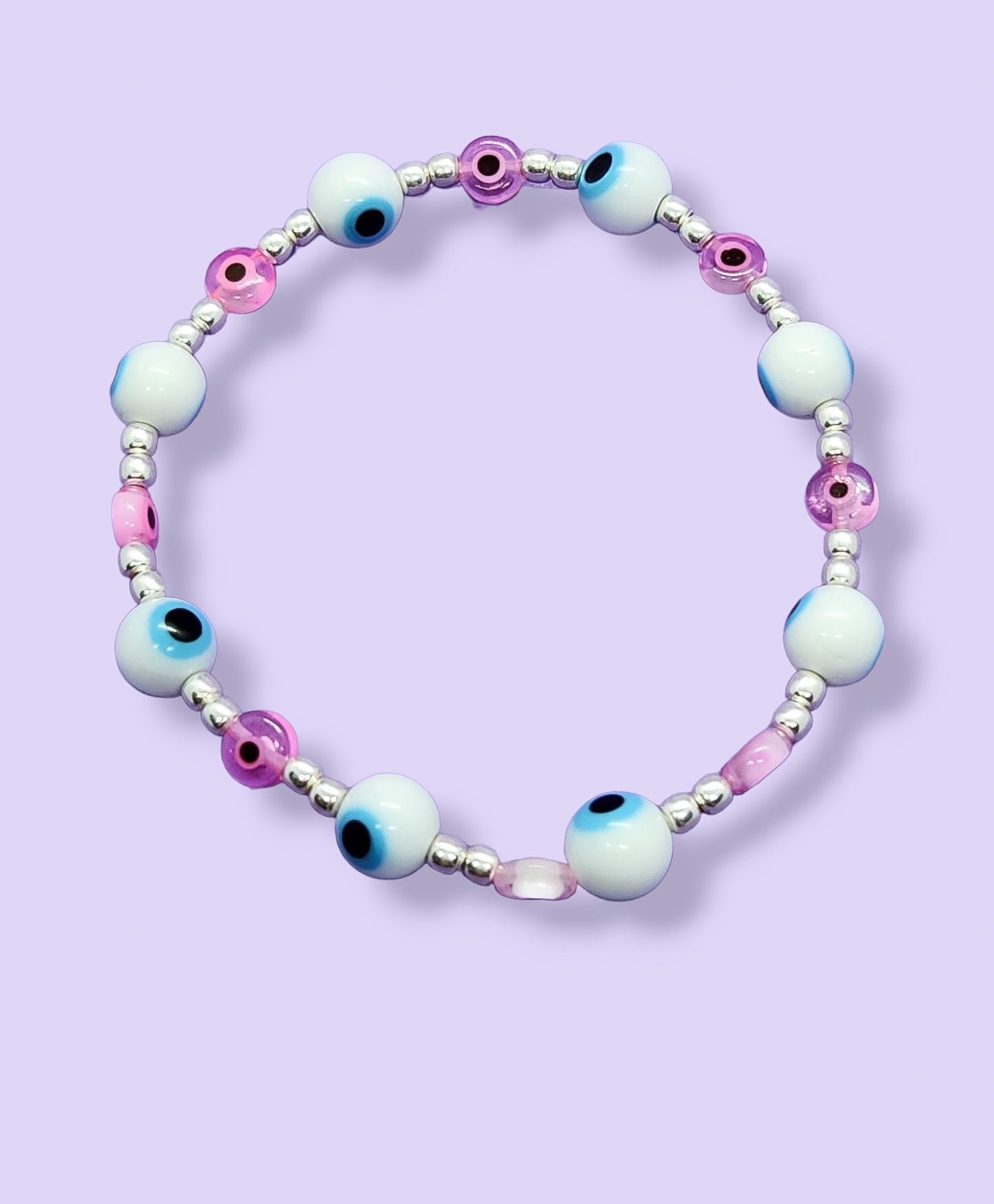 Pulsera de bolitas de plata con ojito turco rosa y blanca