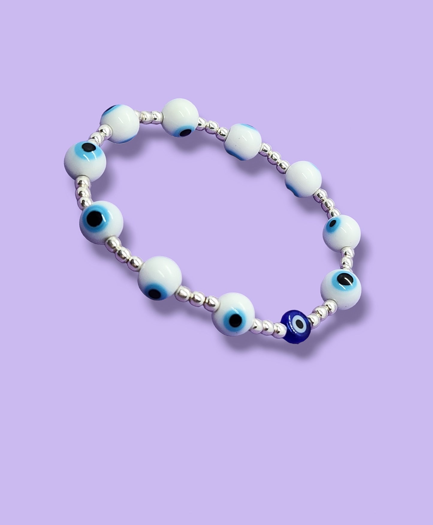 Pulsera de bolitas de plata con ojito turco blancas con azul