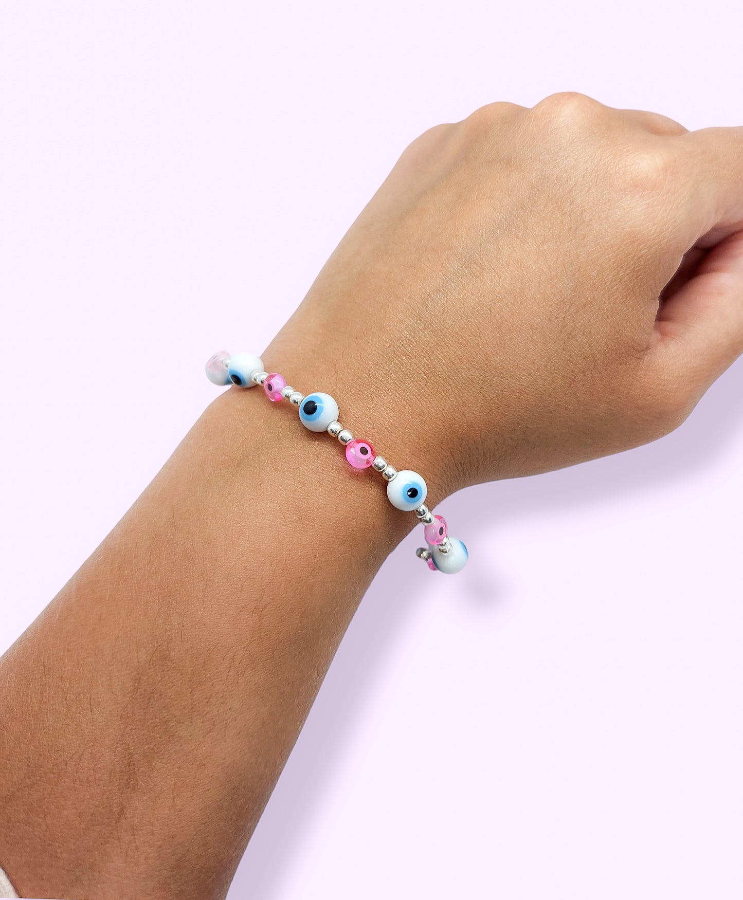 Pulsera de bolitas de plata con ojito turco rosa y blanca