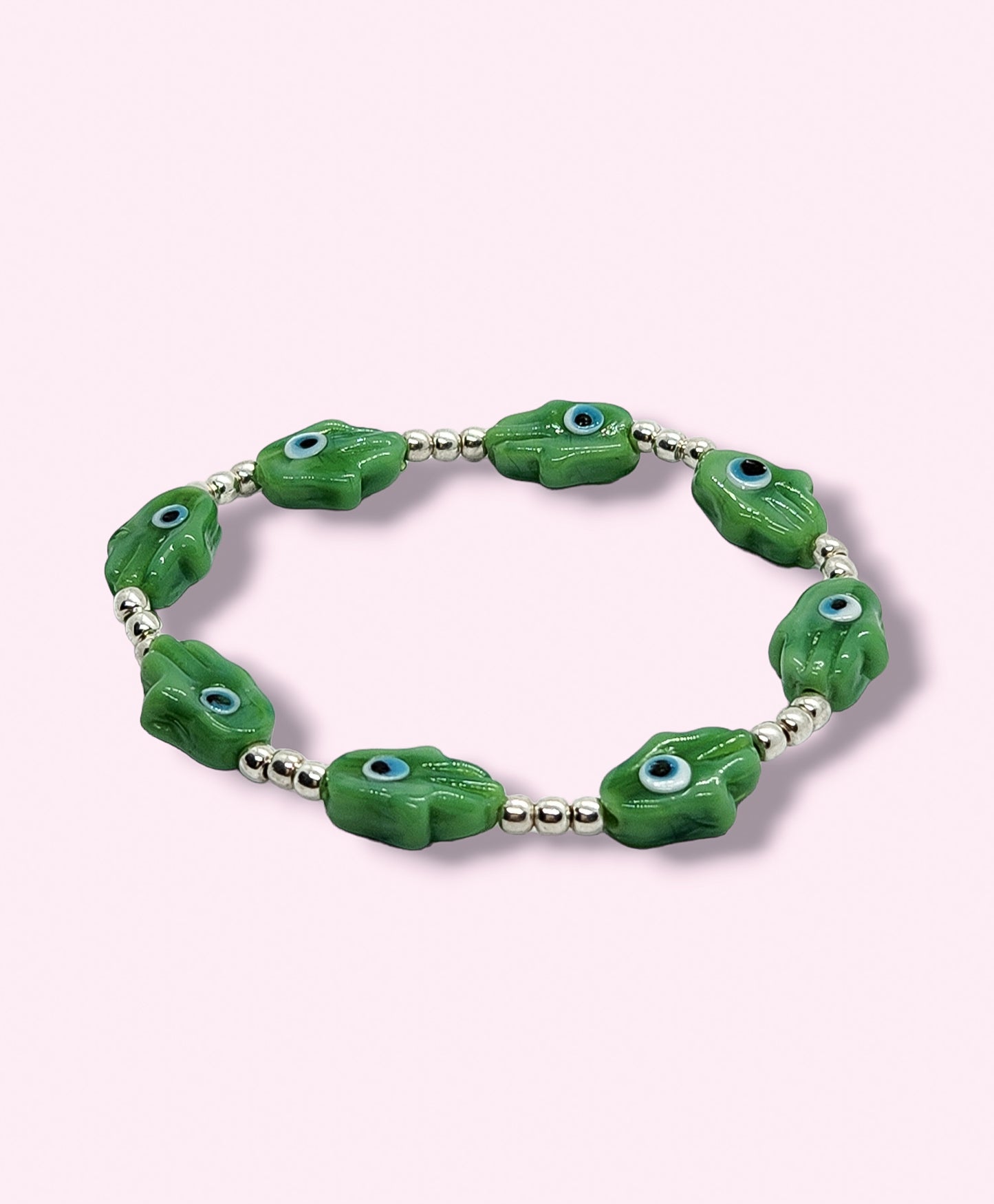 Pulsera de bolitas de plata con mano de fátima y ojito turco VERDE