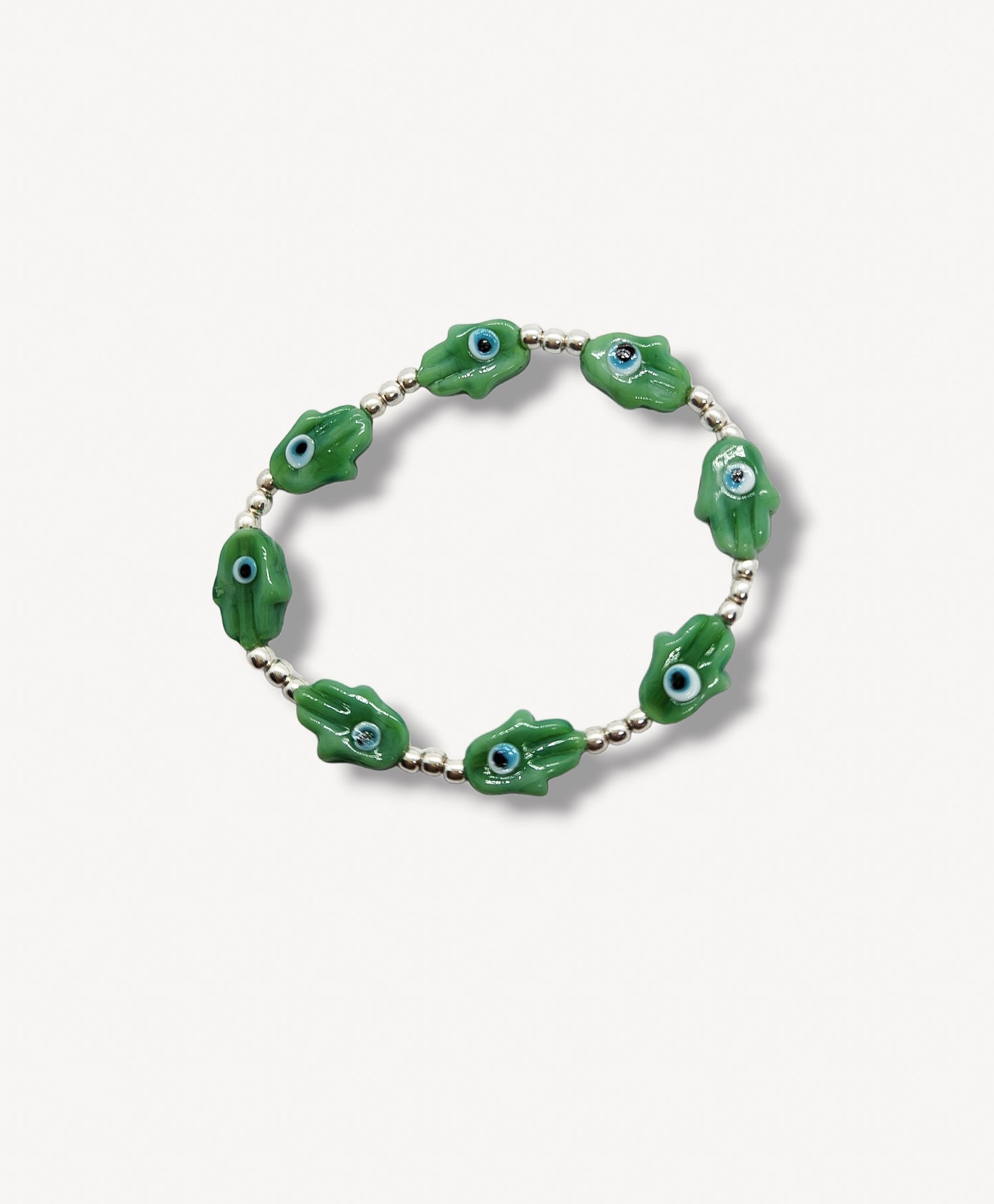 Pulsera de bolitas de plata con mano de fátima y ojito turco VERDE