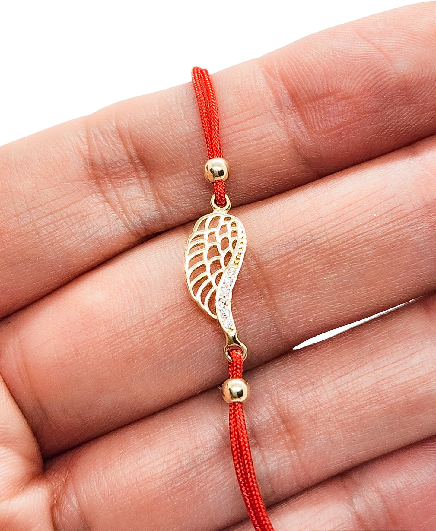 Pulsera alas de ángel de hilo rojo ajustable oro 10k